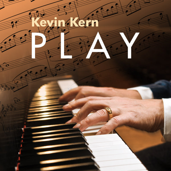 Close up image of Kevin's hands on the piano, sheet music in the background with the words, "Kevin Kern - PLAY", a Spotify playlist