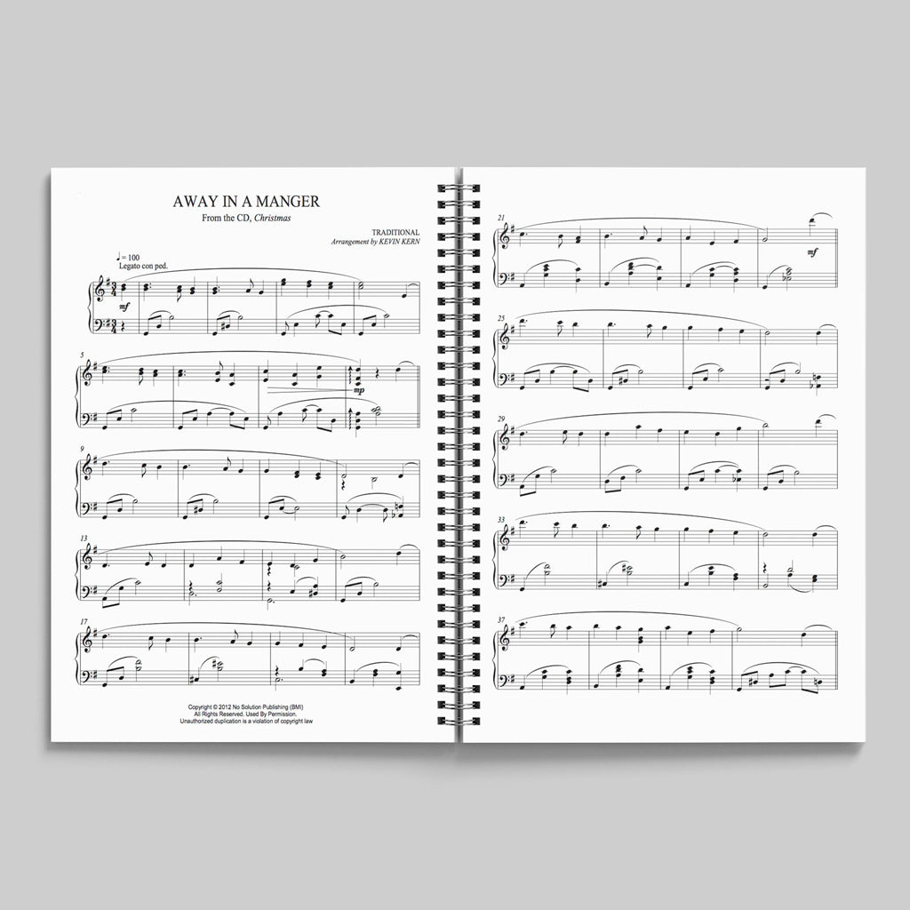 Open view of Christmas piano songbook by Kevin Kern