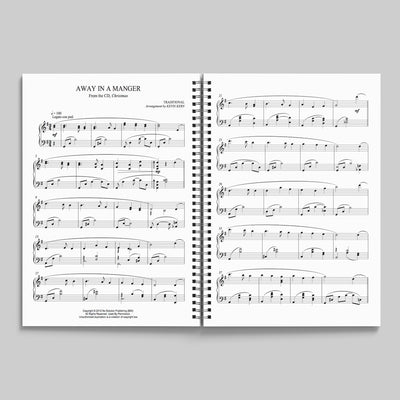 Open view of Christmas piano songbook by Kevin Kern