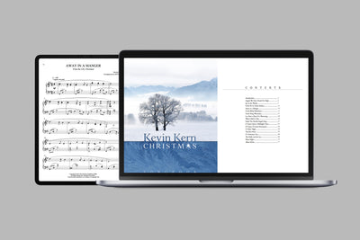 Digital Christmas piano songbook by Kevin Kern displayed on a laptop and iPad.